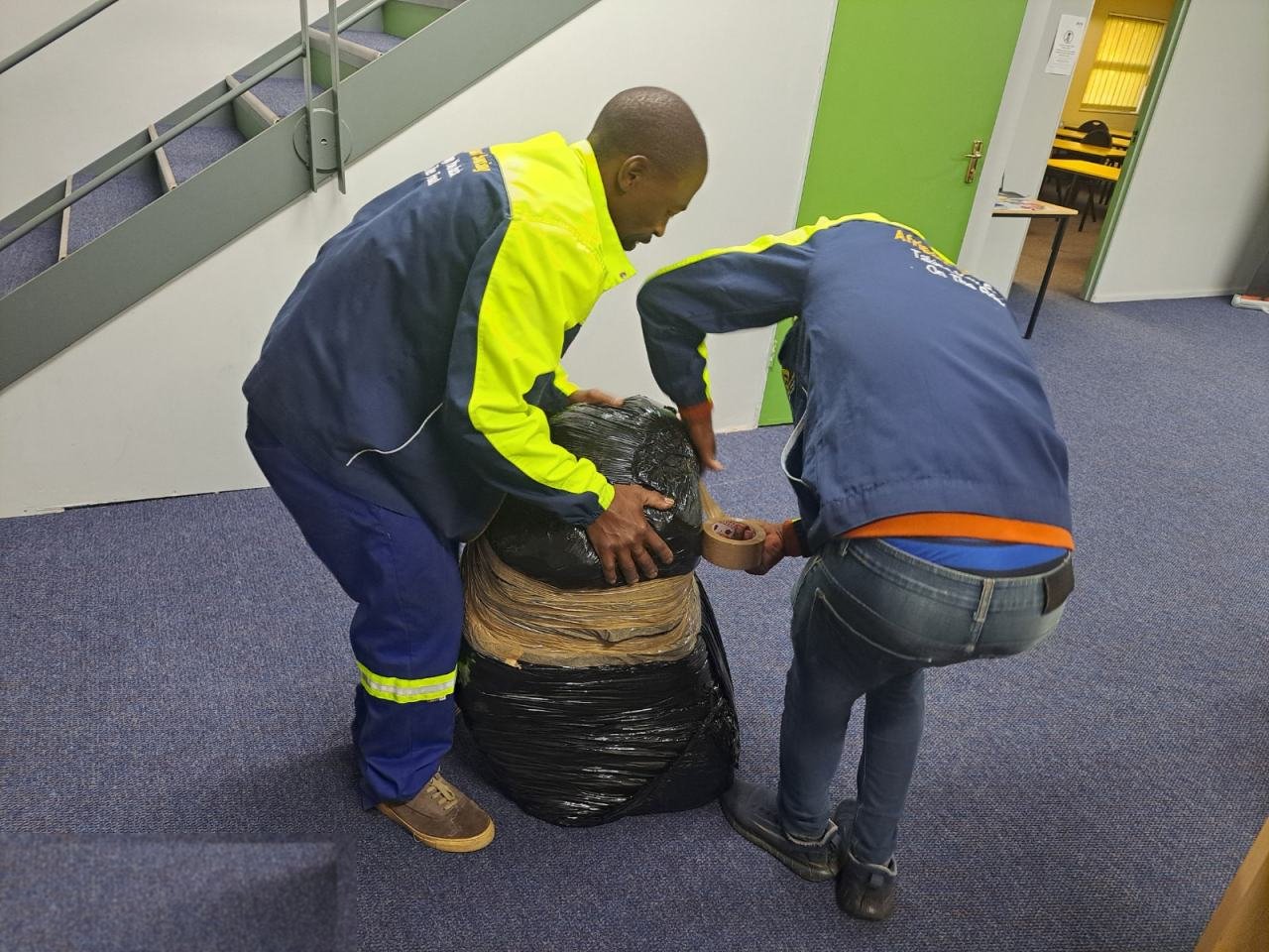Afripart Sourcing staff packing a shipment